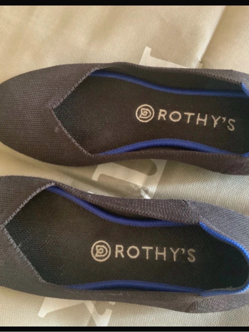 Rothy's Black Knit Flats with Blue Trim Accent